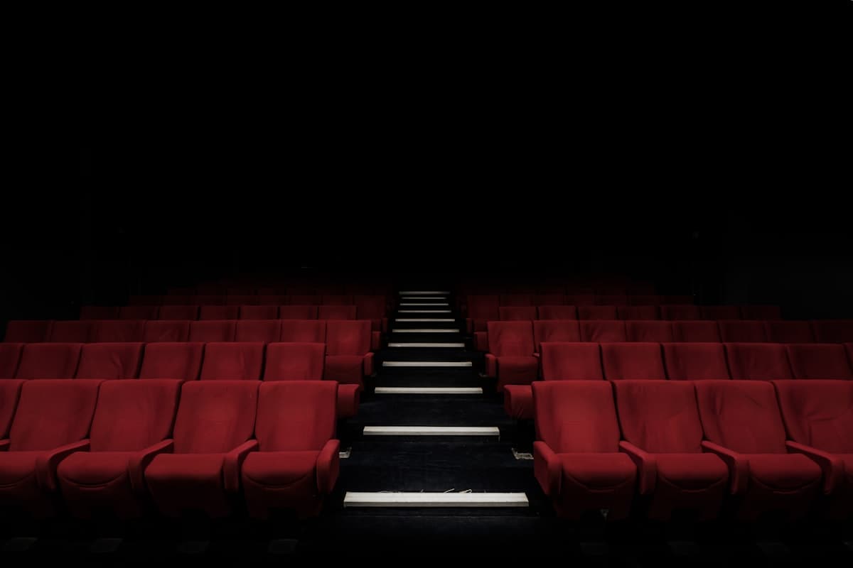 Red cinema seats glowing in the dark