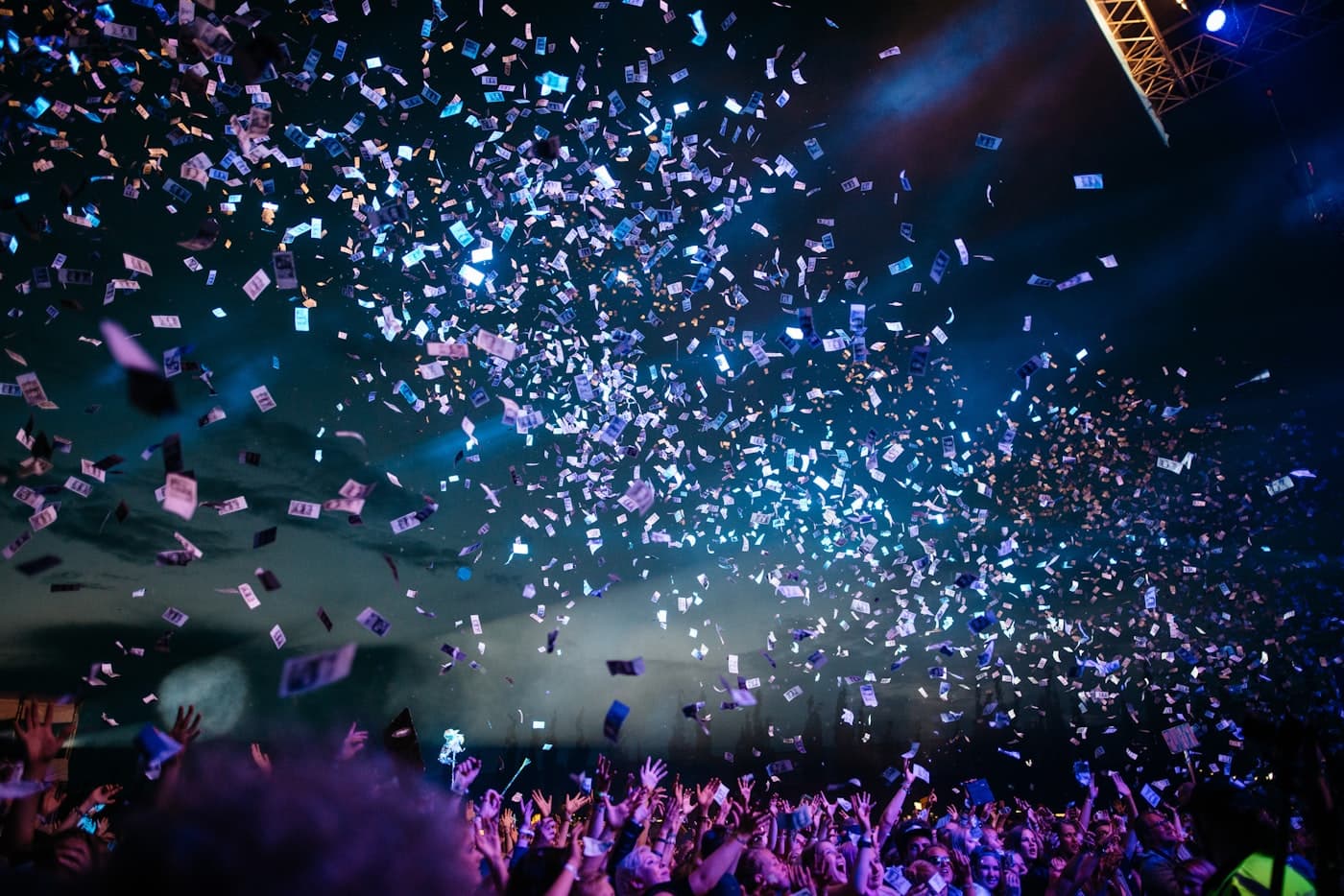 Confetti falling over a celebrating crowd