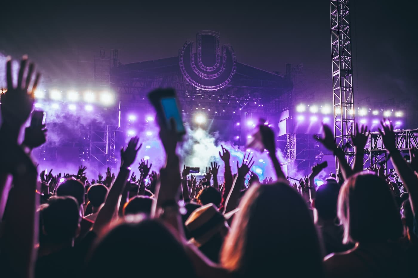 Festival crowd under violet light