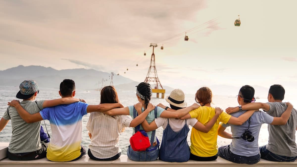 Friends sitting arm in arm